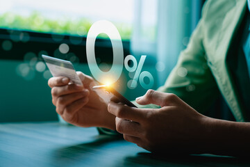 Hands Holding Smartphone and Credit Card with 0% Interest Symbol, Highlighting Digital Payment,...