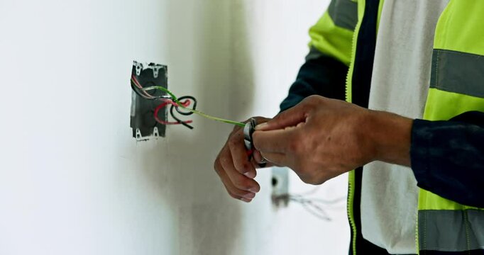 Hands, electrician and handyman with tool, cutting and construction with cable maintenance. Closeup, person and specialist with skills, wiring and engineering with contractor, circuit and expert