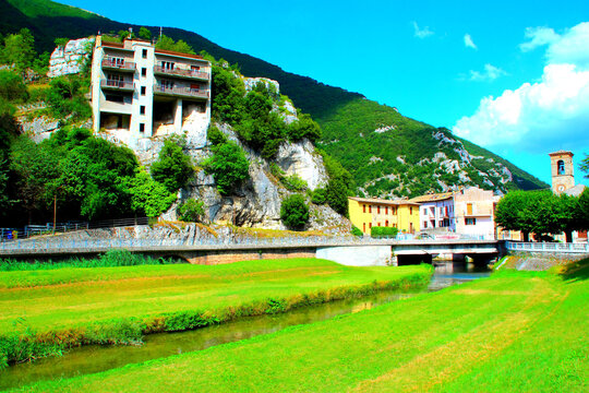 PIORACO, ITALY - JULY 23, 2024: Bridge over the Potenza River. Nestled in the enchanting Potenza Valley, this bridge over the Potenza River in Pioraco offers views and serene access to nature