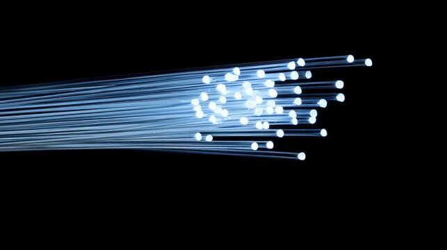 Fiber optics in a dark setting, their tips softly glowing, casting a warm gradient from blue to white