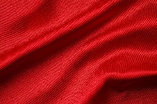 Close-up view of a red jersey material ideal for athletics.