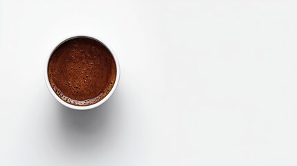 A close-up view of a latte art design, showcasing a beautiful leaf pattern on a creamy cappuccino.