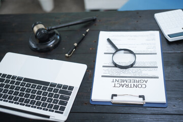 A neatly arranged lawyer's desk with a gavel, legal documents, and scales of justice, symbolizing...