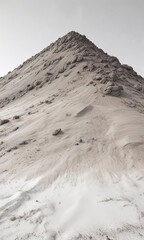 Fototapeta premium A large mound of grayish-brown ash against a pristine white background, brown, landscape, dust