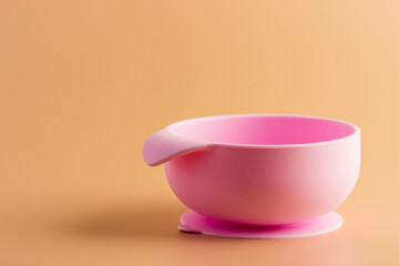 pink non-spilling children's plate on a light background