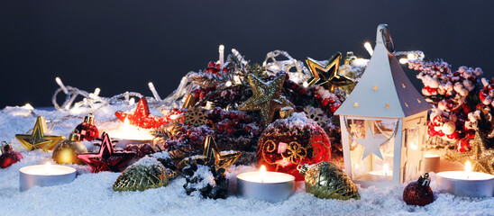 Christmas card balls and lantern on snow