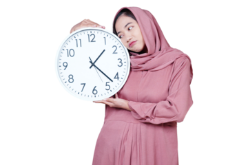 Asian Muslim woman holding alarm clock, waiting for Iftar time isolated transparent