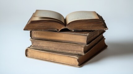 Stack of old, open books on white background.