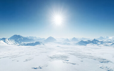 Fototapeta premium Expansive view of a snow-covered landscape under a bright sun