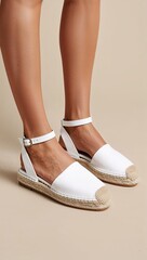 Womens white espadrille sandals with a braided jute sole and ankle strap beige background 