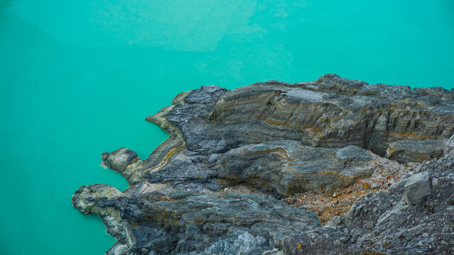 Acid lake view from crater of Kawah Ijen volcano in Java island, Indonesia