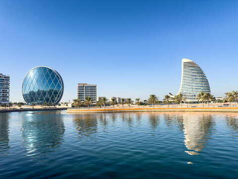 Aldar Headquarters Building, also known as The Disk and the residential Al Sail Tower in Al Raha Beach area, Abu Dhabi