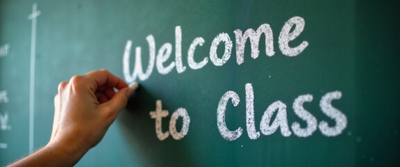 Warm welcome to class on Education Day with creative chalk writing on green board