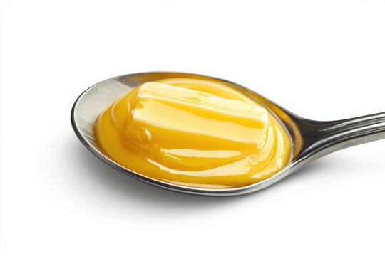 tablespoon of butter on silver spoon, smooth and creamy texture