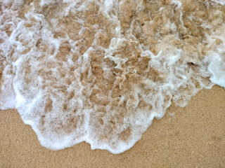 Close up shot of waves at the beach