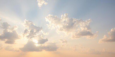 Obraz premium Softly glowing summer sky with puffy white cumulus clouds scattered across the horizon, summer blue, open space