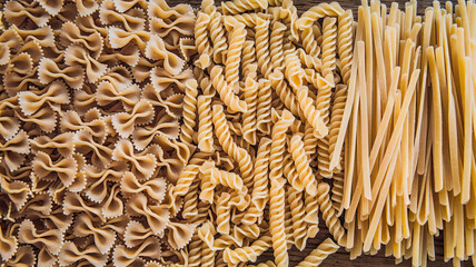 Assortment of Yellow Pasta Arranged in Three Distinct Rows, Uniform Color Indicating Durum Wheat Semolina, Neatly Organized for a Simple and Elegant Presentation