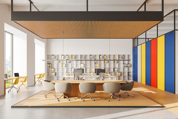 Modern coworking office with colorful accents, spacious layout, and contemporary furniture,...