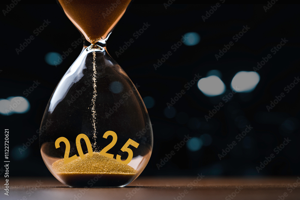 Poster hourglass with 2025 on dark background with bokeh and copy space for preparation and countdown of ne