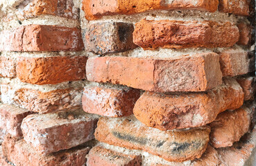 Old brick wall.\Dilapidated ancient brick wall.\Old brick wall in antiquity and was damaged by the...