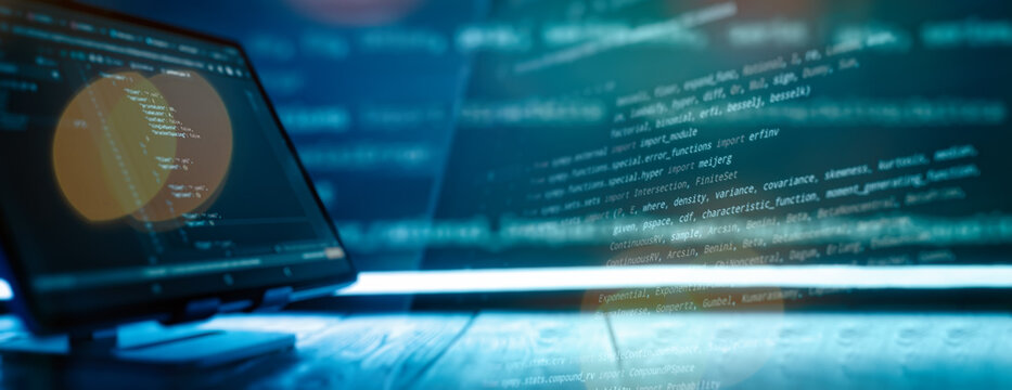 Abstract software development concept with code and laptop on blurred background representing programming, coding and technology