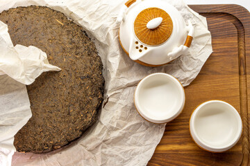 Tea set for making and drinking  on a white background. Teapot and cups, pressed black tea. Tea...