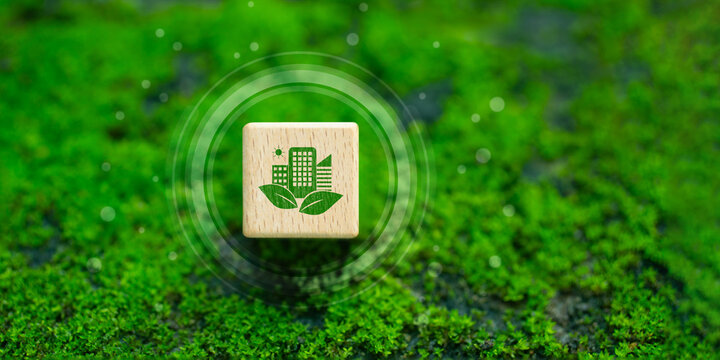 Sustainable green building, Eco-friendly building, Future green business concept, Environmental sustainability goals, Green building icon on wooden block