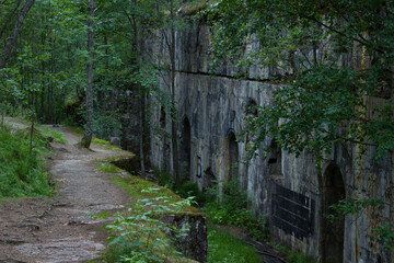 Abandoned stone ammunition storage cellar from 1916 in the forest. Monrepos Park. Vyborg.