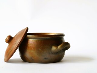 An ancient clay vessel, a gendok, was traditionally used in Javanese ceremonies to hold sacred...