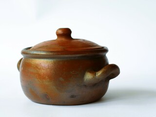 An ancient clay vessel, a gendok, was traditionally used in Javanese ceremonies to hold sacred...