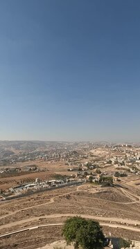 A stunning view from Herodium, overlooking the Judean Mountains and surrounding settlements, capturing the beautiful landscape and ancient ruins of this UNESCO World Heritage Site. israel.