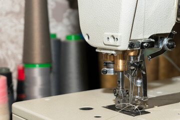 Sewing machine in operation at a textile workshop in the afternoon