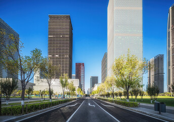 Urban Sprawl: Park and Skyscrapers Under Blue Sky