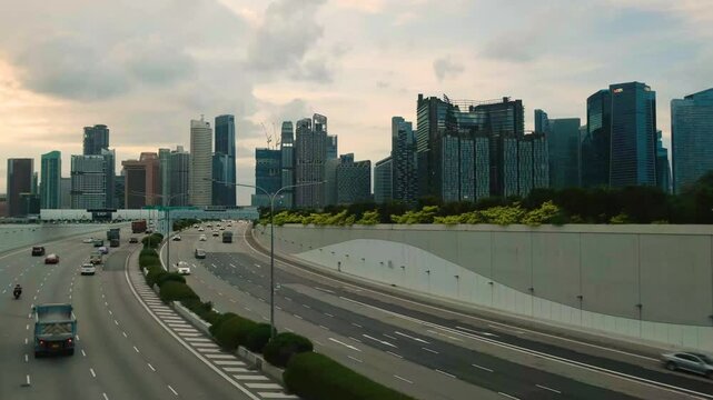 Sunset Scene of Downtown Singapore with Traffic Car City Timelapse. The Marina Coastal Expressway (MCE) is a key underground expressway in Singapore, spanning approximately 5 kilometres.