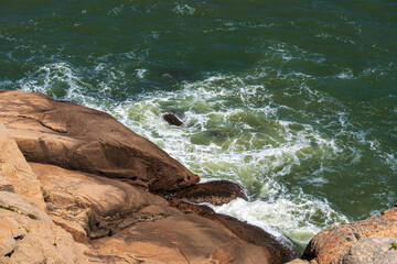 Serene Coastal Landscape with Waves Crashing on Rocks