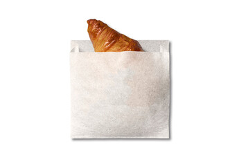 A freshly baked croissant with a golden, flaky crust peeks out of a simple, eco-friendly paper bag....