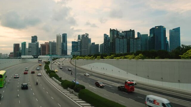 Sunset Scene of Downtown Singapore with Traffic Car City Timelapse. The Marina Coastal Expressway (MCE) is a key underground expressway in Singapore, spanning approximately 5 kilometres.
