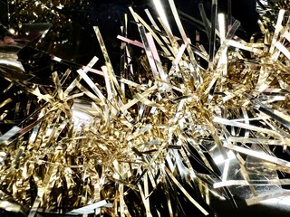 golden bauble with black as background for celebration cards, invitations, for new year wishes and christmas, for party wallpaper