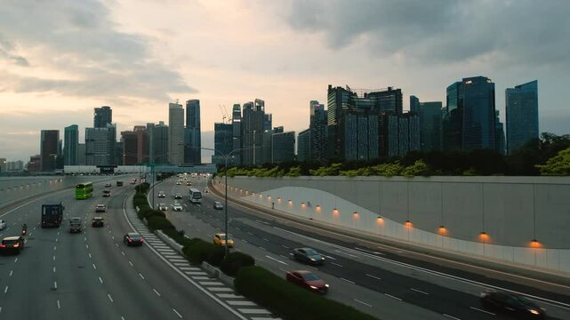 Sunset Scene of Downtown Singapore with Traffic Car City Timelapse. The Marina Coastal Expressway (MCE) is a key underground expressway in Singapore, spanning approximately 5 kilometres.