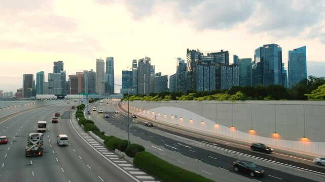Sunset Scene of Downtown Singapore with Traffic Car City Timelapse. The Marina Coastal Expressway (MCE) is a key underground expressway in Singapore, spanning approximately 5 kilometres.