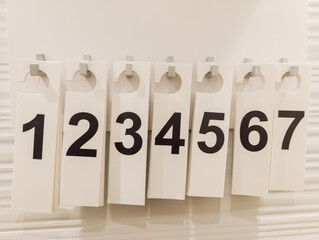 A number board with numbers hanging on a wall