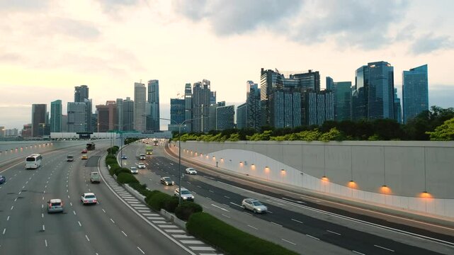 Sunset Scene of Downtown Singapore with Traffic Car City Timelapse. The Marina Coastal Expressway (MCE) is a key underground expressway in Singapore, spanning approximately 5 kilometres.