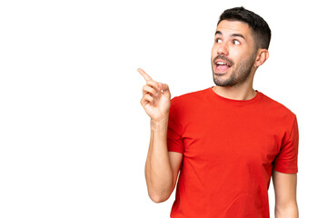 Young handsome caucasian man over isolated chroma key background intending to realizes the solution...