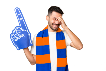 Young caucasian sports fan man over isolated chroma key background laughing
