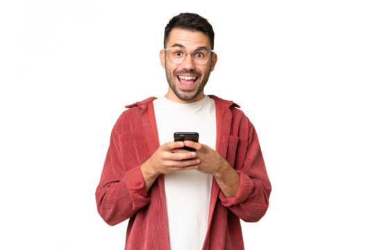 Young handsome caucasian man over isolated chroma key background surprised and sending a message