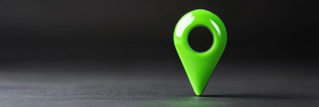 Glossy green location marker stands out on a minimalist black background