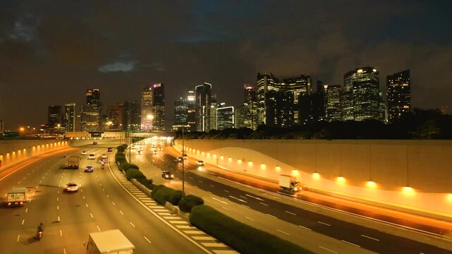 Night Scene of Downtown Singapore with Traffic Car City Timelapse. The Marina Coastal Expressway (MCE) is a key underground expressway in Singapore, spanning approximately 5 kilometres.