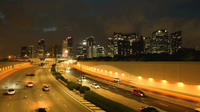 Night Scene of Downtown Singapore with Traffic Car City Timelapse. The Marina Coastal Expressway (MCE) is a key underground expressway in Singapore, spanning approximately 5 kilometres.