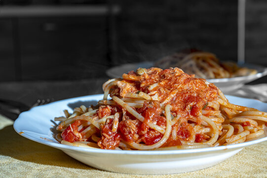 Plate of spaghetti with tuna and tomato