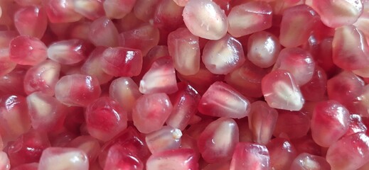 Delicious sweet Pomegranate seeds or buah delima background